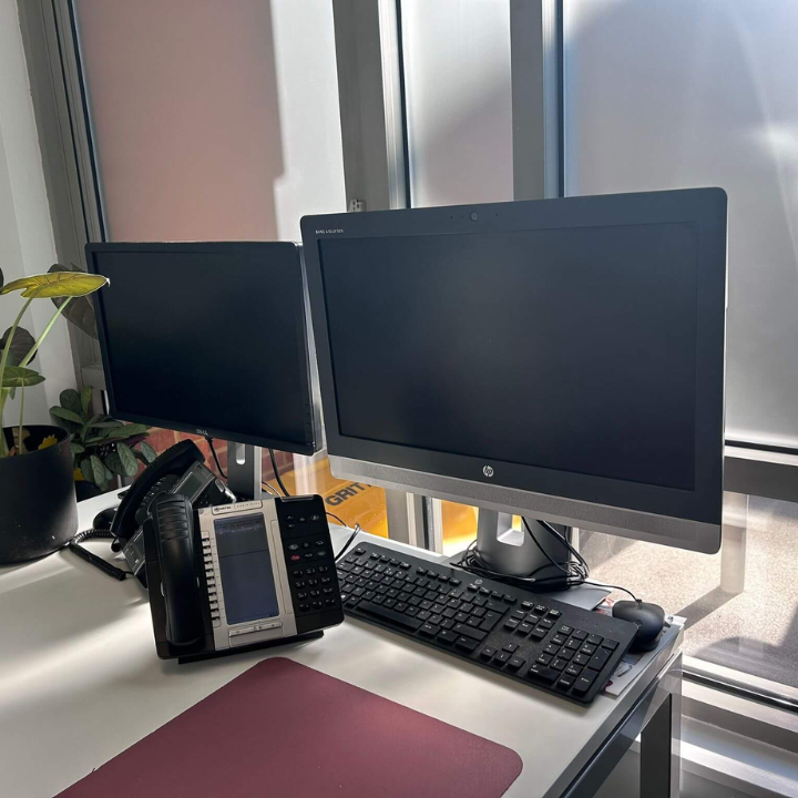 a desk with a phone phone and a phone