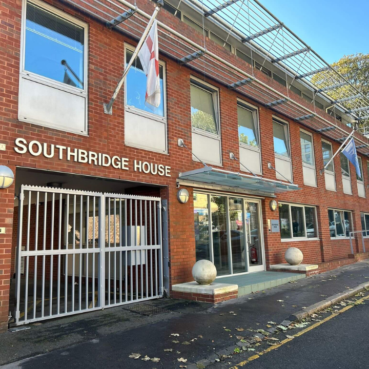 a building with a flag on it and a flag on the side of the building